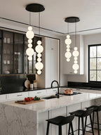 White Multi Globe Pendant Light for Staircase and High Ceiling over a marble kitchen island